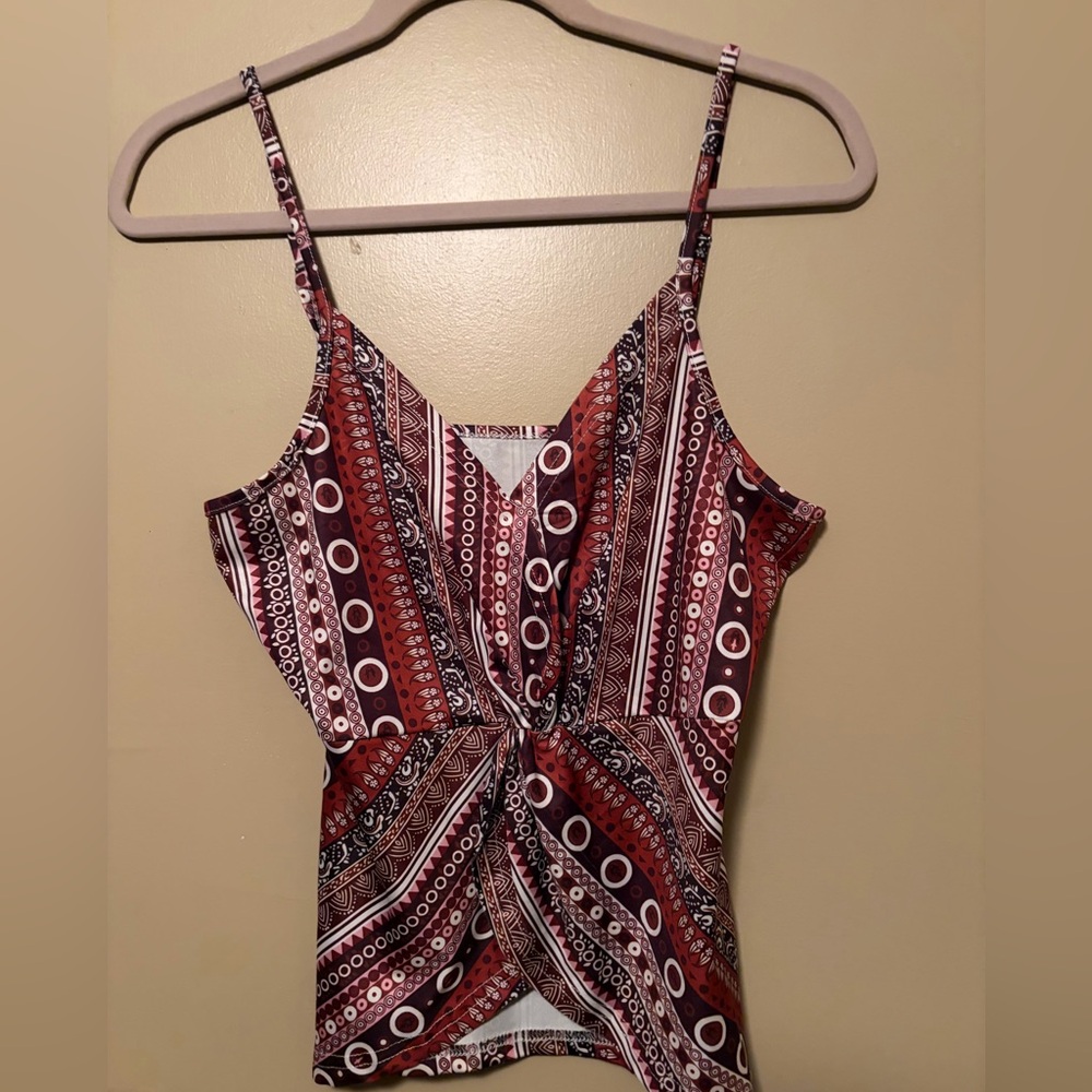 Spaghetti strap top. With adjustable straps.